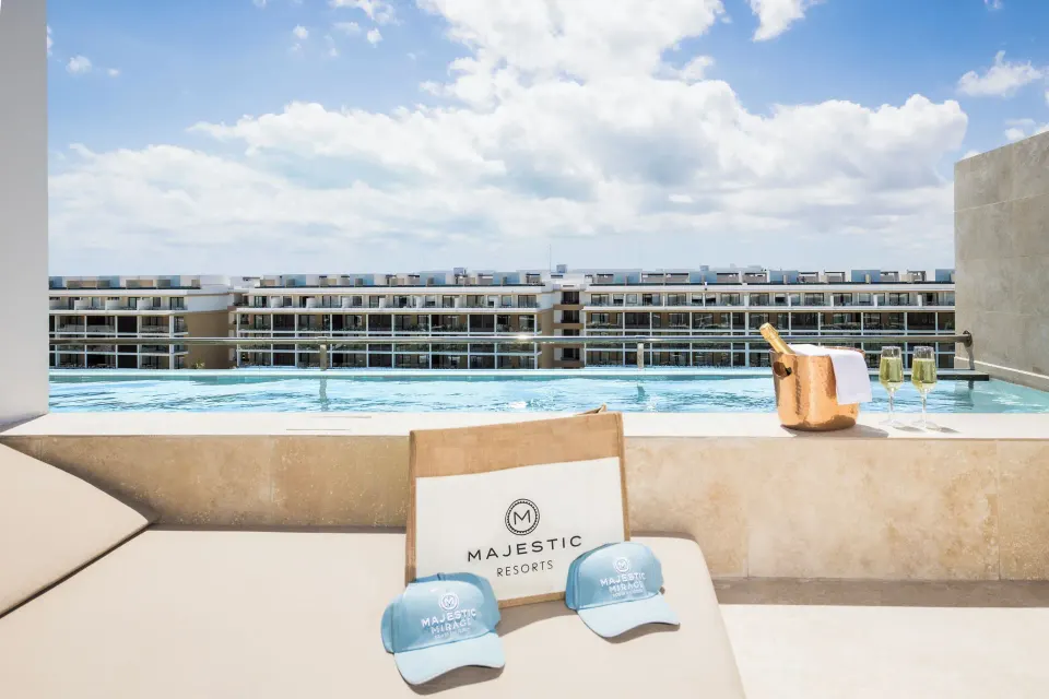 Family Club Plunge Pool Suite private plunge pool at Majestic Mirage Costa Mujeres overlooking resort buildings.