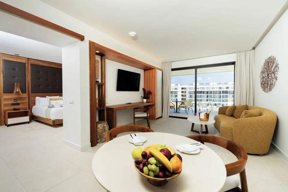 Suite living room and bedroom doorway at Majestic Mirage Costa Mujeres.