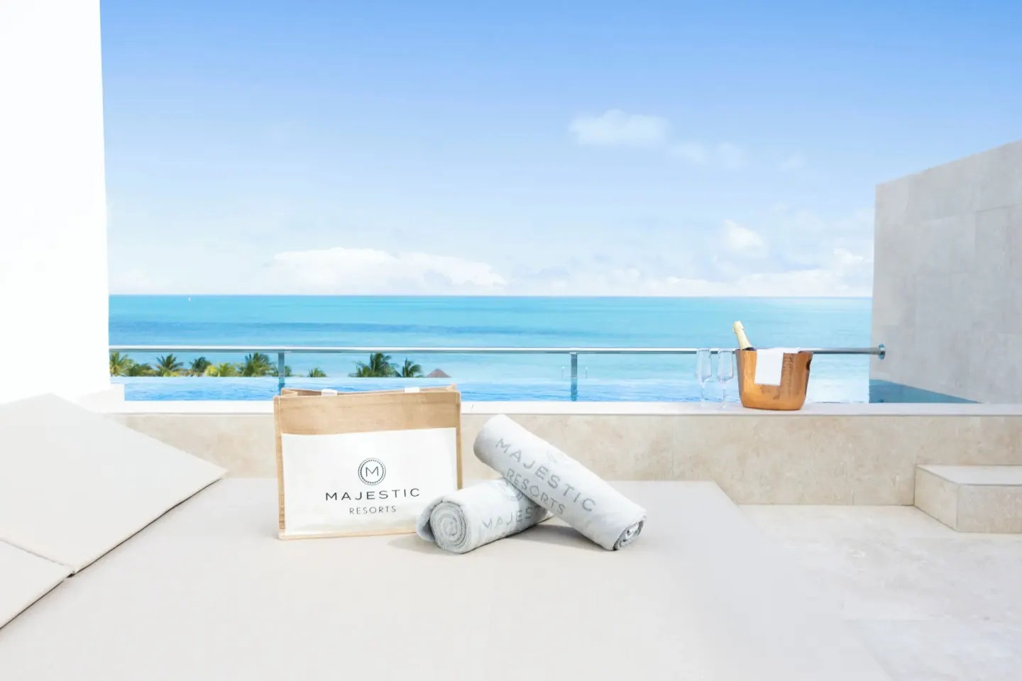 Private plunge pool terrace with towels and ocean view at Majestic Mirage Costa Mujeres.