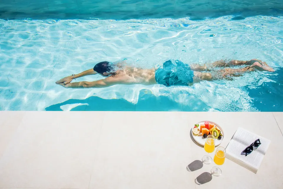 Swimmer in the suite swim-up pool at Majestic Mirage Costa Mujeres.