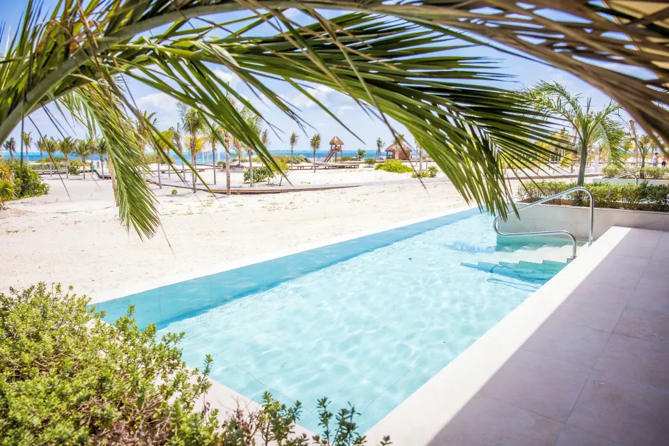 Swim-up pool outside Mirage Club Oceanfront Suite at Majestic Mirage Costa Mujeres.