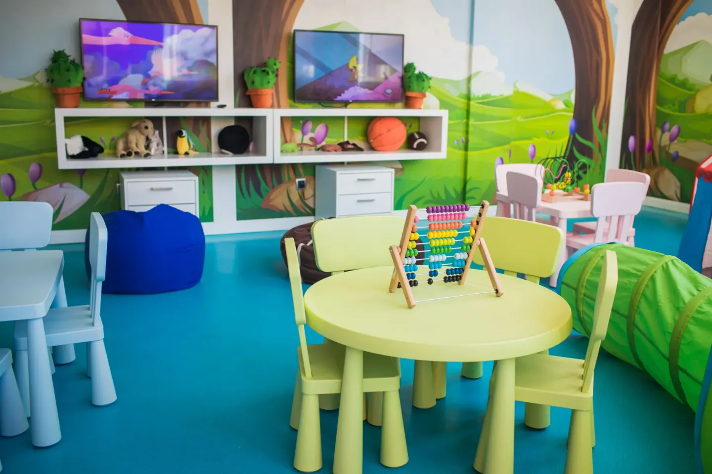 A colorful children’s playroom with small tables and toys at Majestic Mirage Punta Cana.