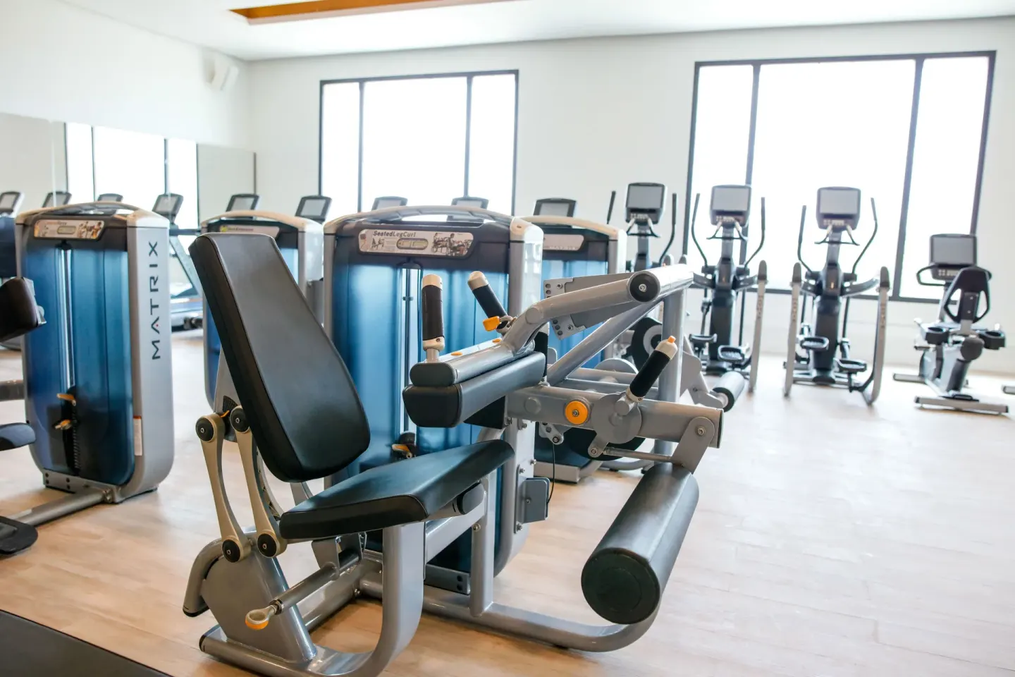 Fitness room with strength machines and cardio equipment at Majestic Mirage Punta Cana.