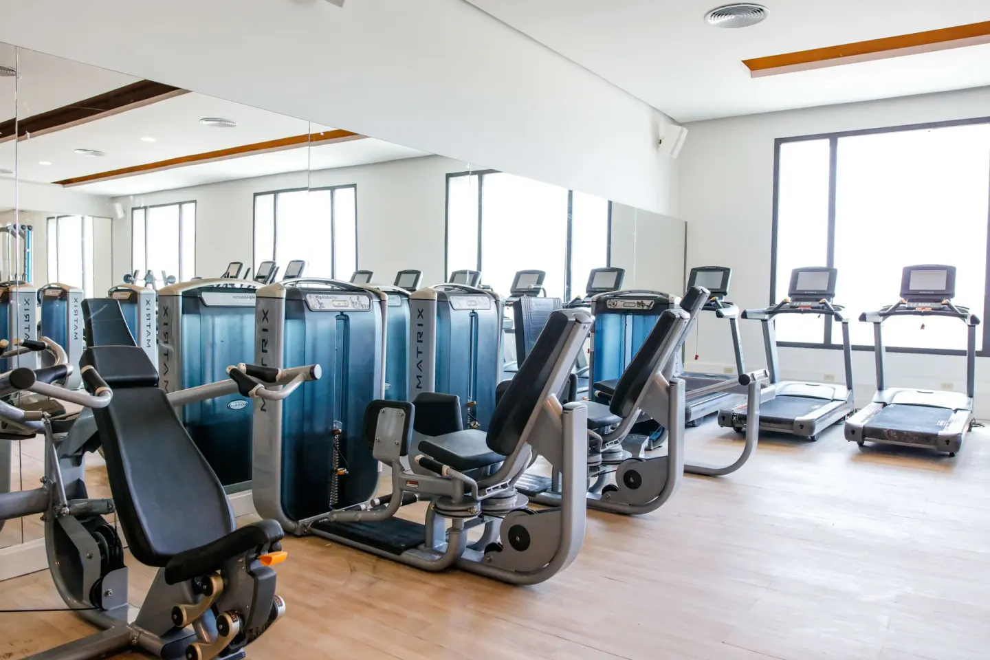 Gym with treadmills, mirrors, and weight machines at Majestic Mirage Punta Cana.