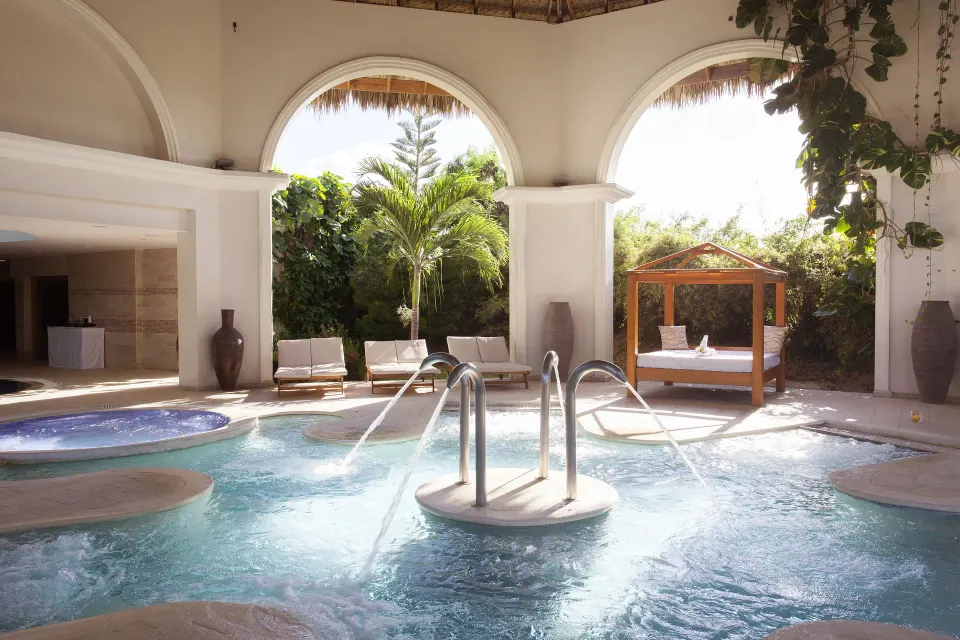 Spa pool with water jets, loungers, and a cabana at Majestic Mirage Punta Cana.