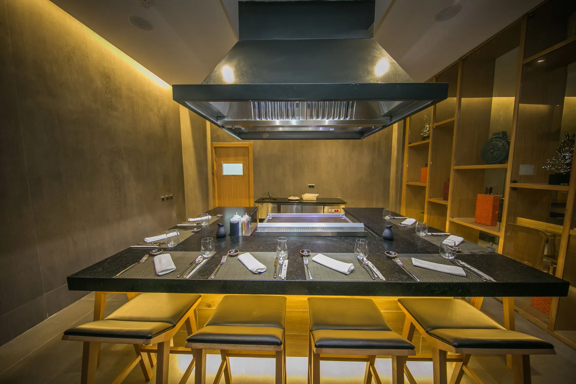 Teppanyaki-style dining counter set with place settings at Majestic Mirage Punta Cana.