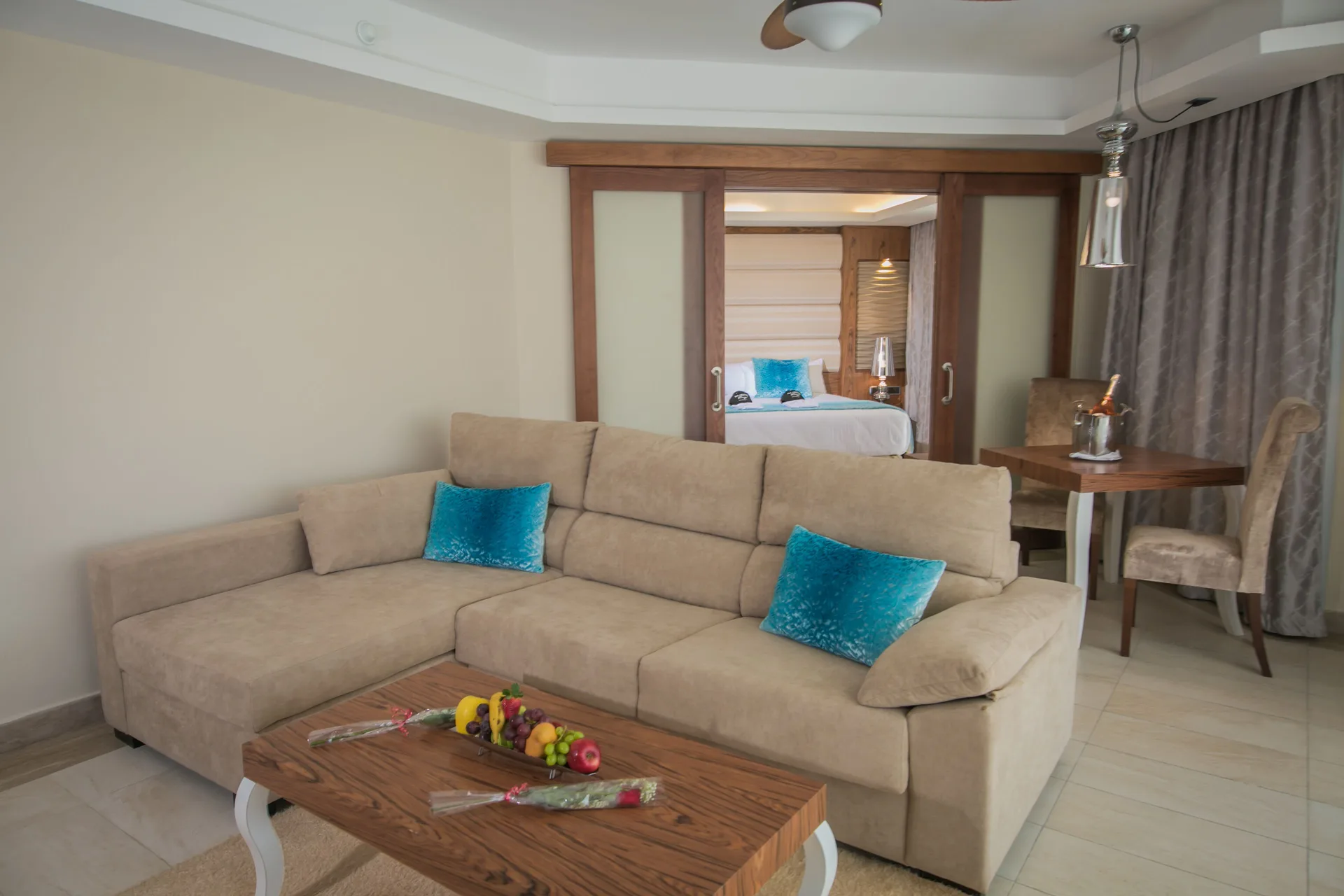 Family Suite living area with sofa and bedroom beyond at Majestic Mirage Punta Cana.