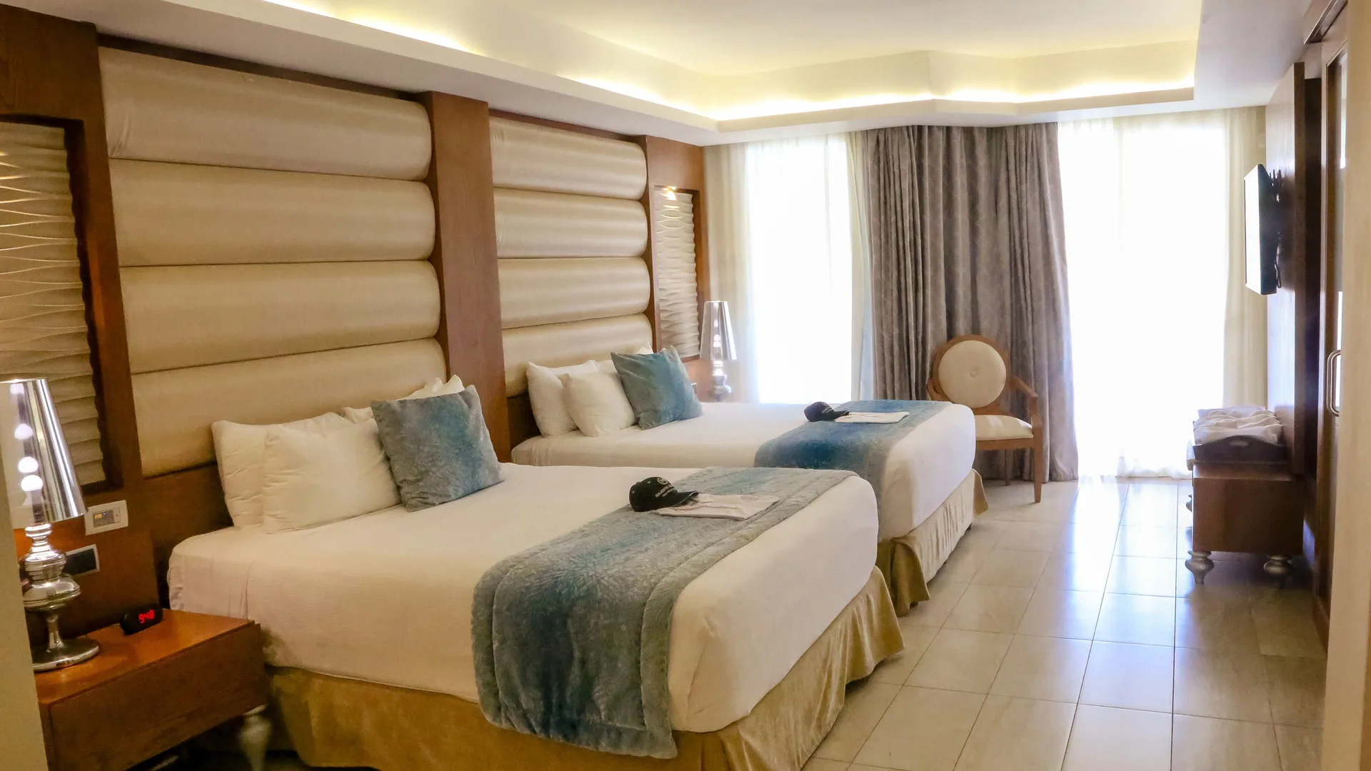 Two beds in a Mirage Club Ocean View Suite at Majestic Mirage Punta Cana.