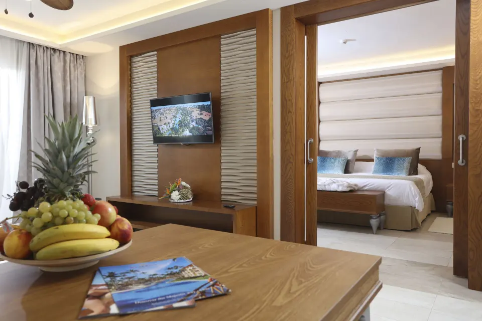 Fruit tray and TV in the suite living area at Majestic Mirage Punta Cana.