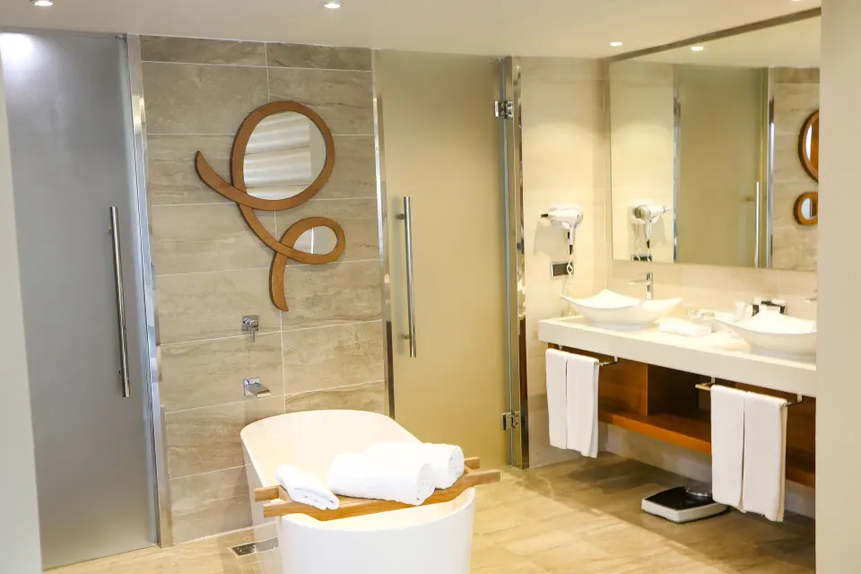One Bedroom Suite bathroom with tub and double vanity at Majestic Mirage Punta Cana.