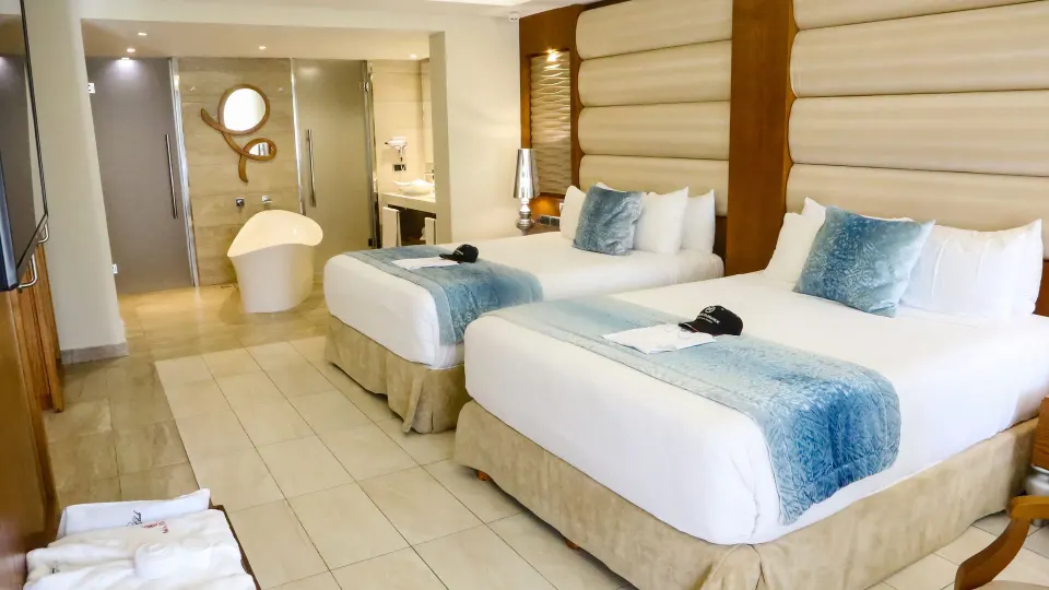 One Bedroom Suite with two beds and open bathroom at Majestic Mirage Punta Cana.