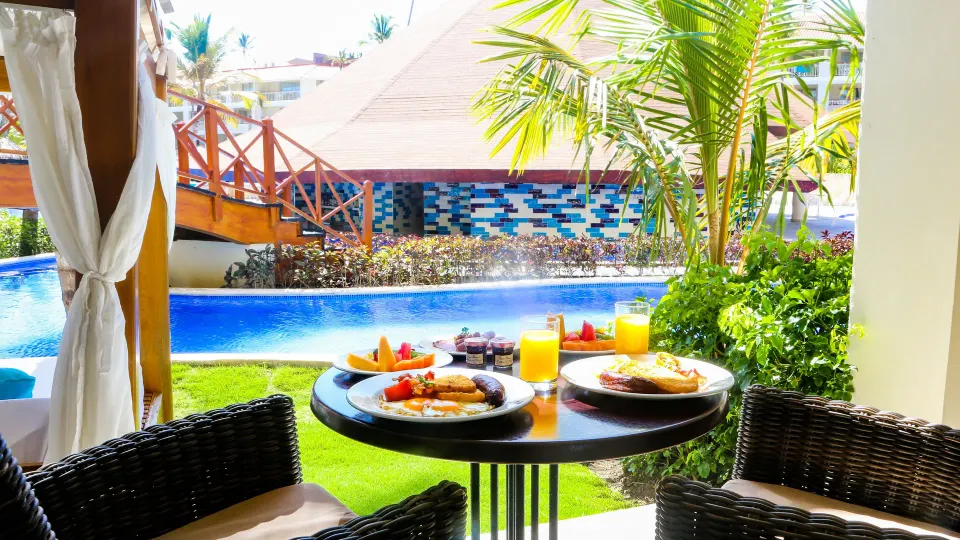 Swim Up Suite terrace breakfast with pool and bridge at Majestic Mirage Punta Cana.