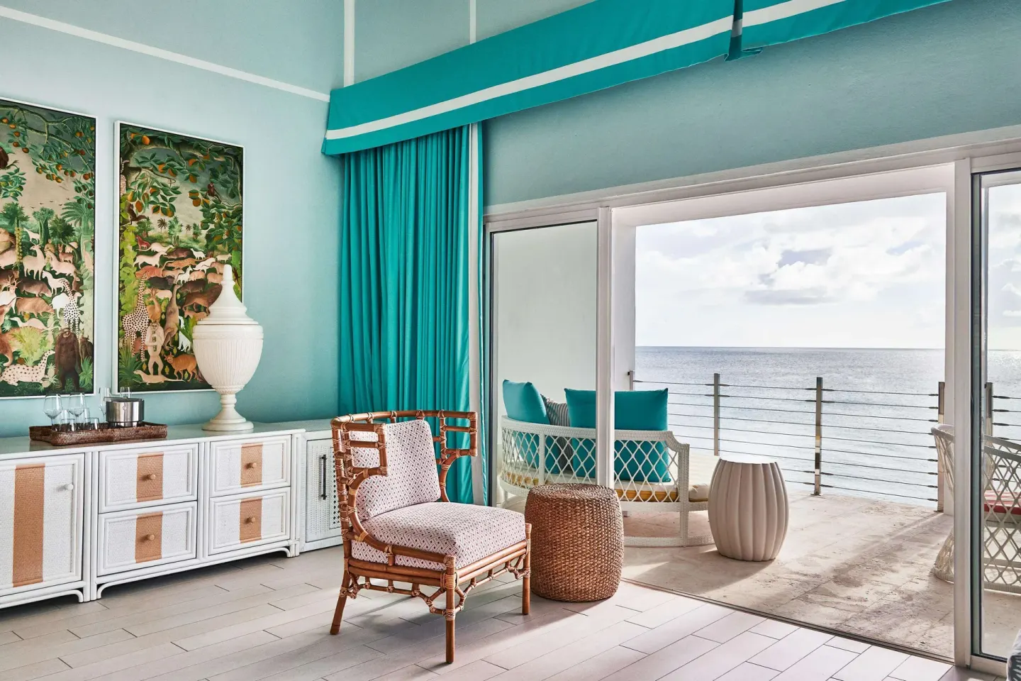 Guest room sitting area opening to an ocean terrace at Malliouhana Resort Anguilla.