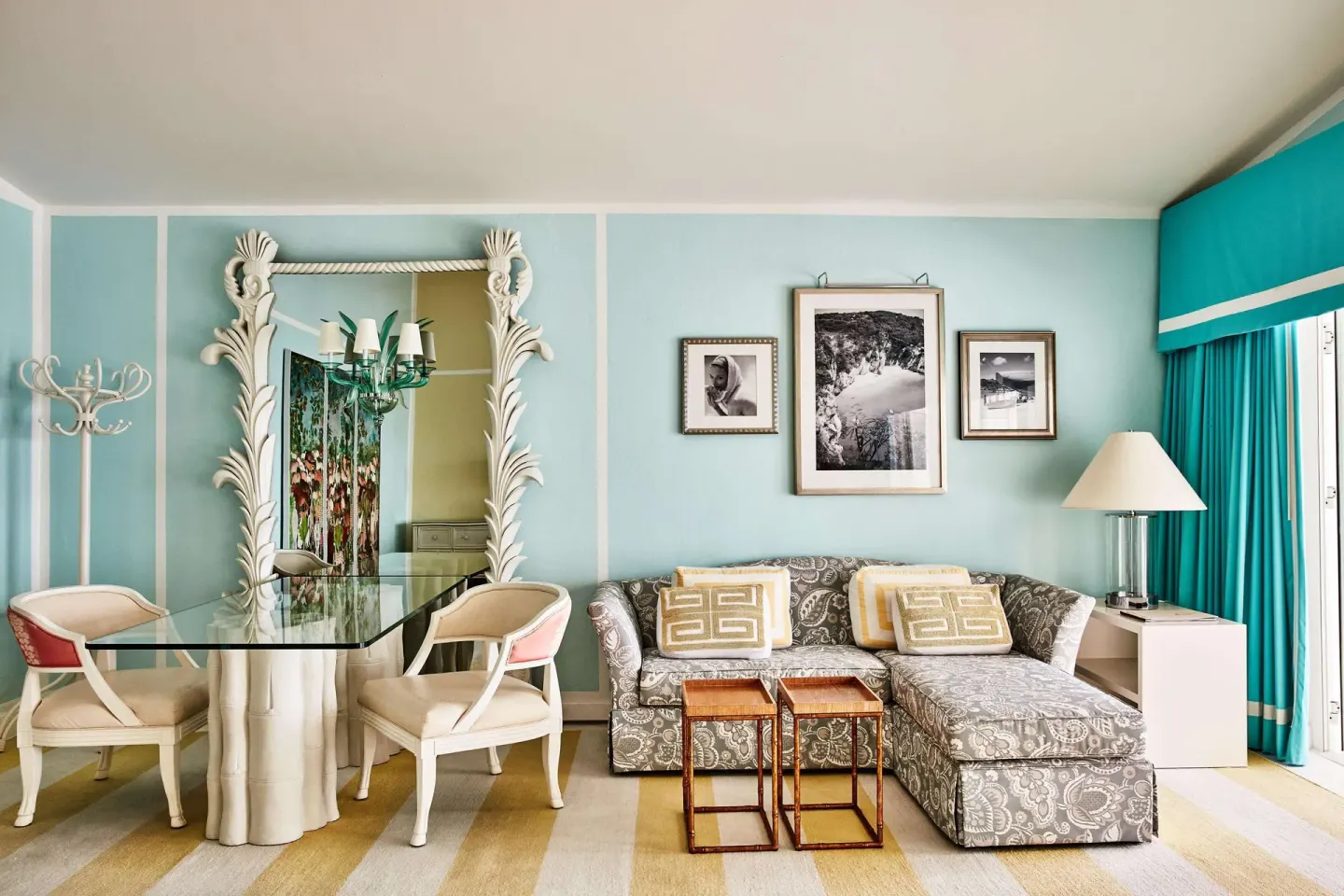 Guest suite living and dining area with turquoise walls at Malliouhana Resort Anguilla.