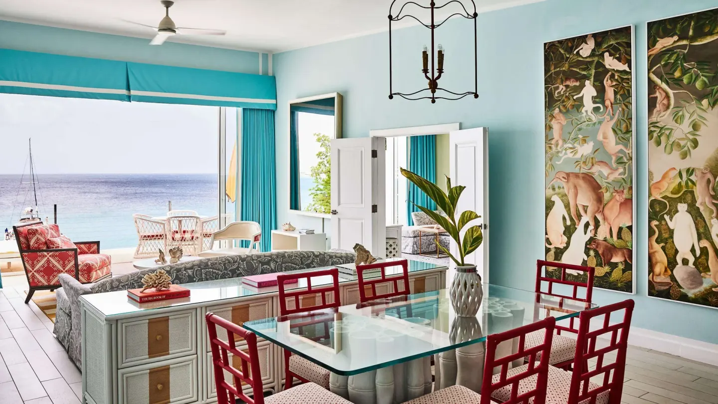 Ocean-view living and dining area in a suite at Malliouhana Resort Anguilla.