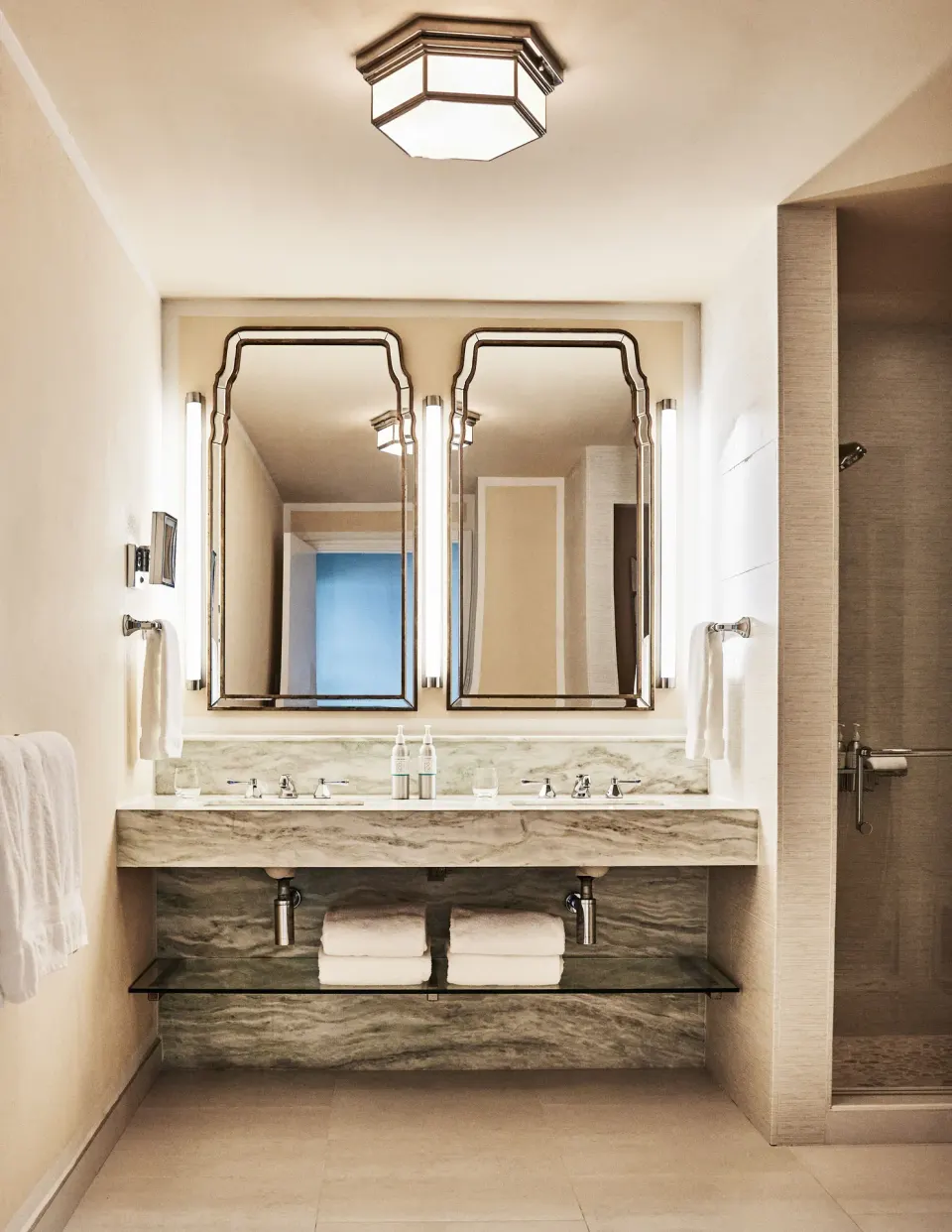 Garden View Deluxe bathroom vanity with twin mirrors at Malliouhana Resort Anguilla.