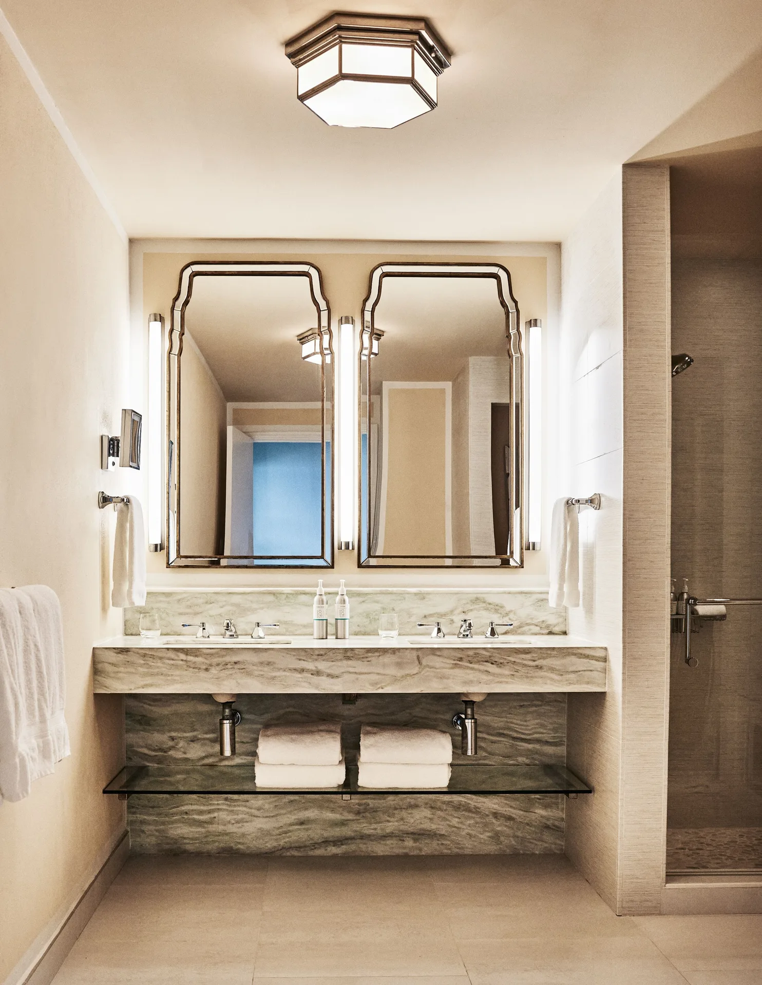 Garden View Deluxe bathroom vanity with twin mirrors at Malliouhana Resort Anguilla.