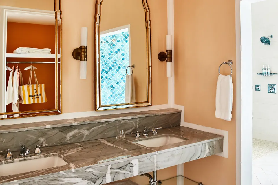 Junior Suite bathroom with double marble vanity and shower at Malliouhana Resort Anguilla.