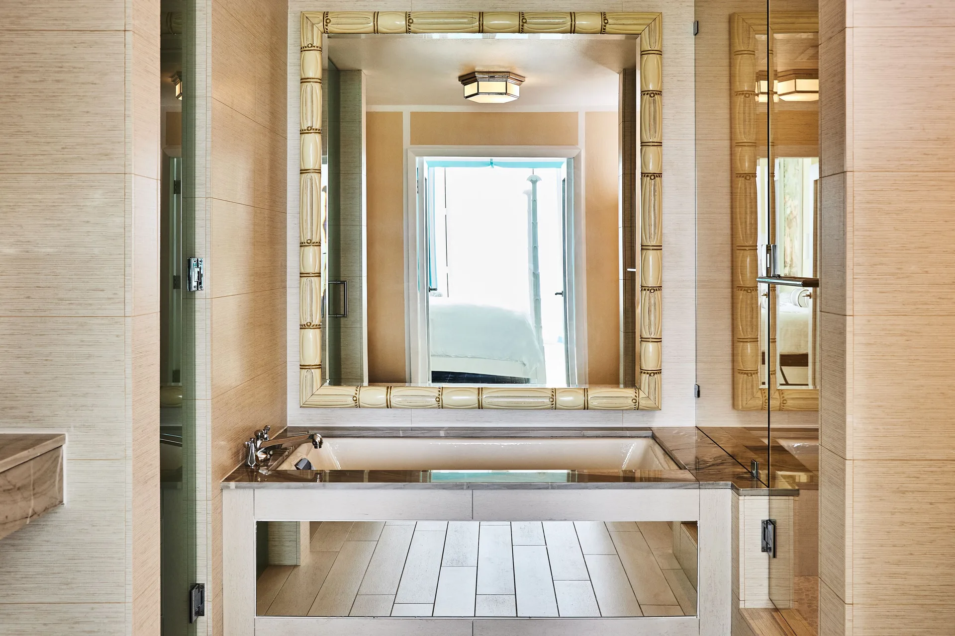 Ocean View Deluxe Room bathroom at Malliouhana Resort Anguilla with soaking tub, elegant finishes, and Caribbean ambiance.