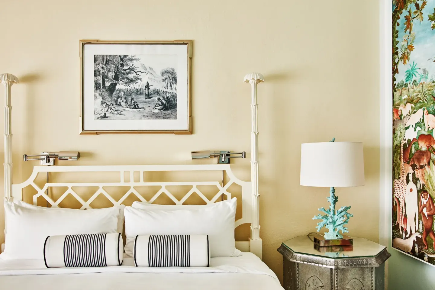 Close-up of an Ocean View Premium Two Beds bed at Malliouhana Resort Anguilla with lamp and tropical wall art.