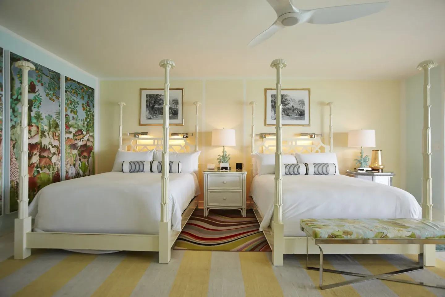 Ocean View Premium Two Beds guest room at Malliouhana Resort Anguilla with two canopy beds and colorful decor.