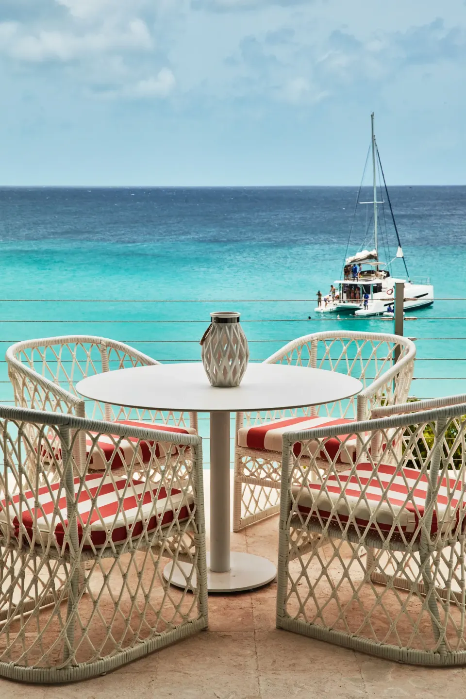 Spa Suite terrace seating overlooking turquoise water at Malliouhana Resort Anguilla.