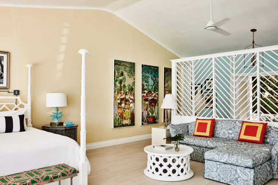 Turtle Cove Suite king bed and sitting area at Malliouhana Resort Anguilla.