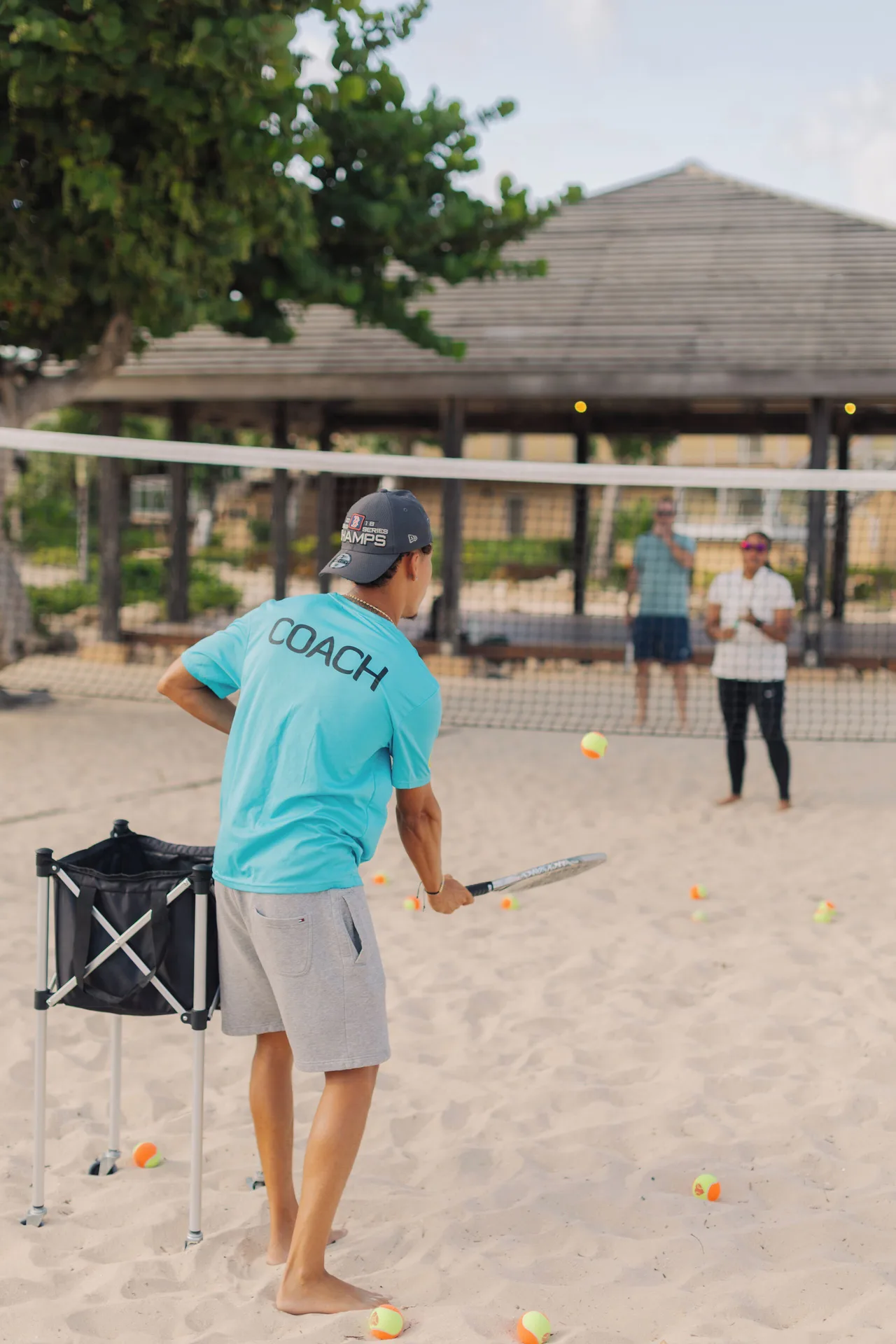 Beach tennis coaching on the sand at Manchebo Beach Resort and Spa.