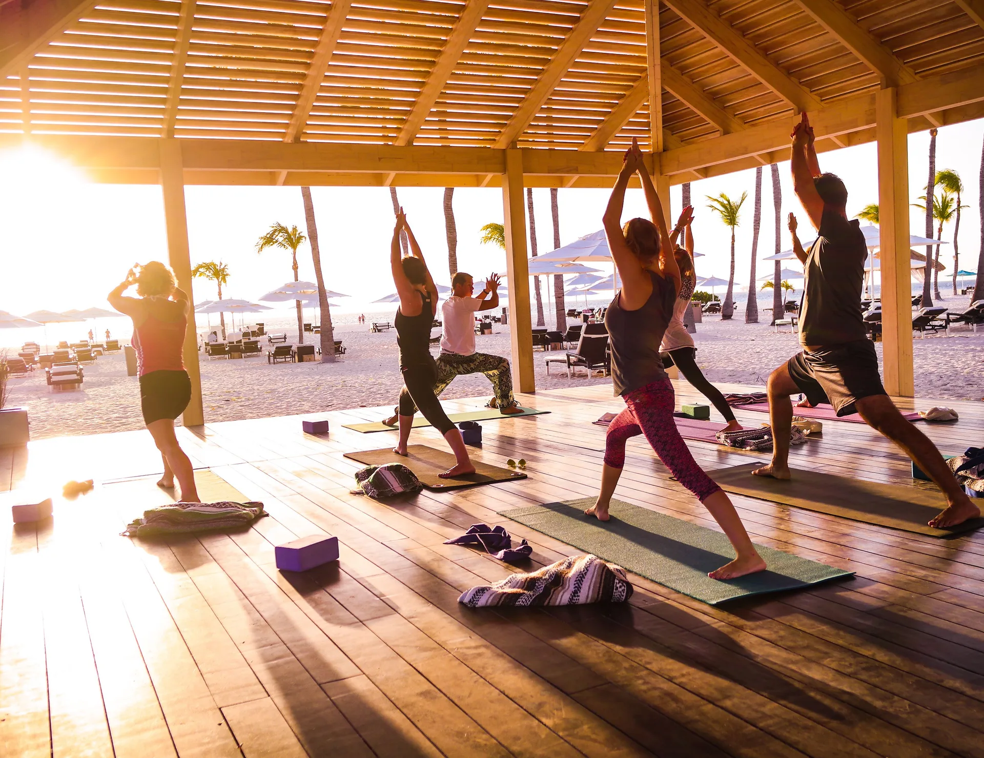 Sunset yoga class in a beachfront pavilion at Manchebo Beach Resort and Spa.