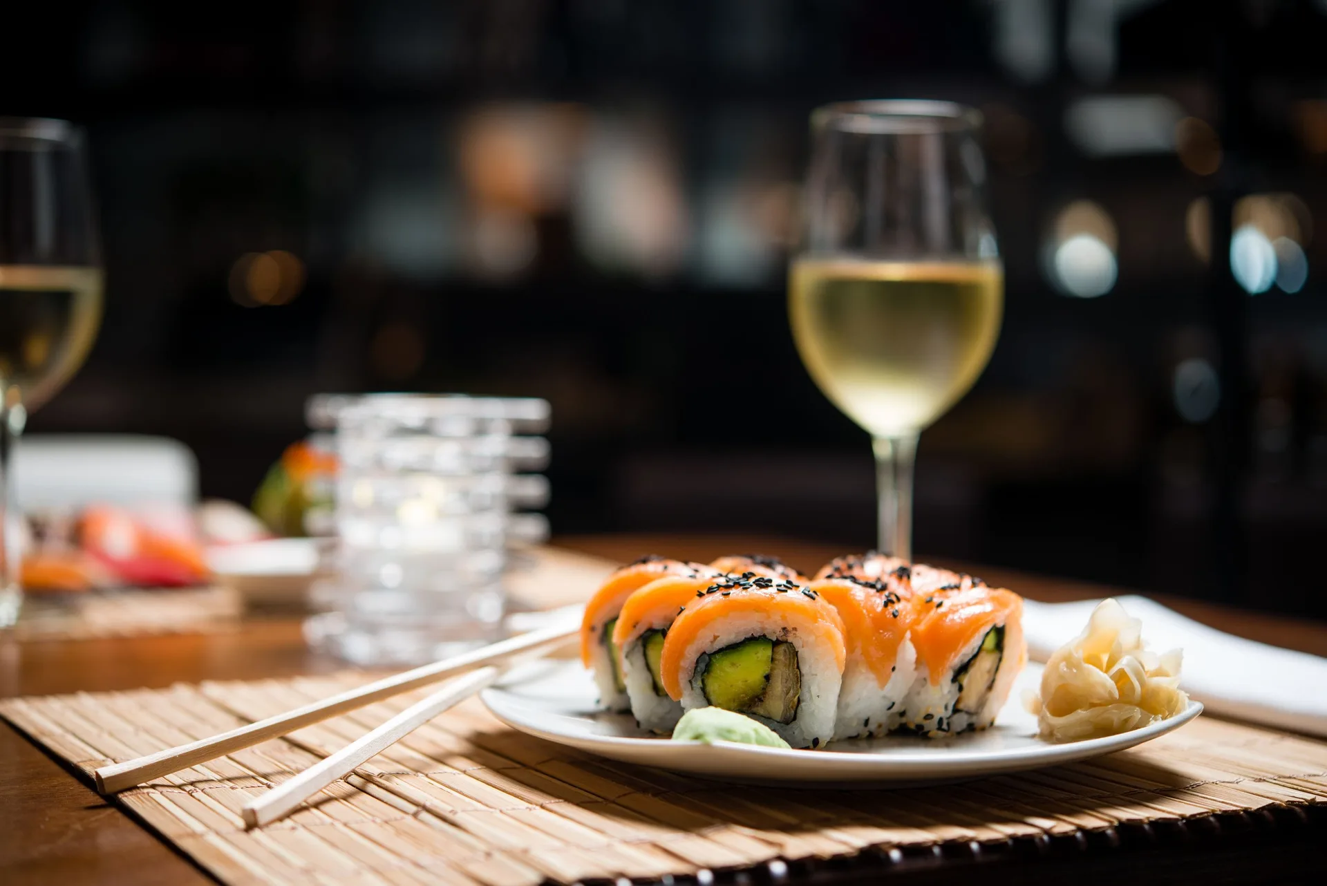 Sushi rolls with chopsticks and white wine at Manchebo Beach Resort and Spa.