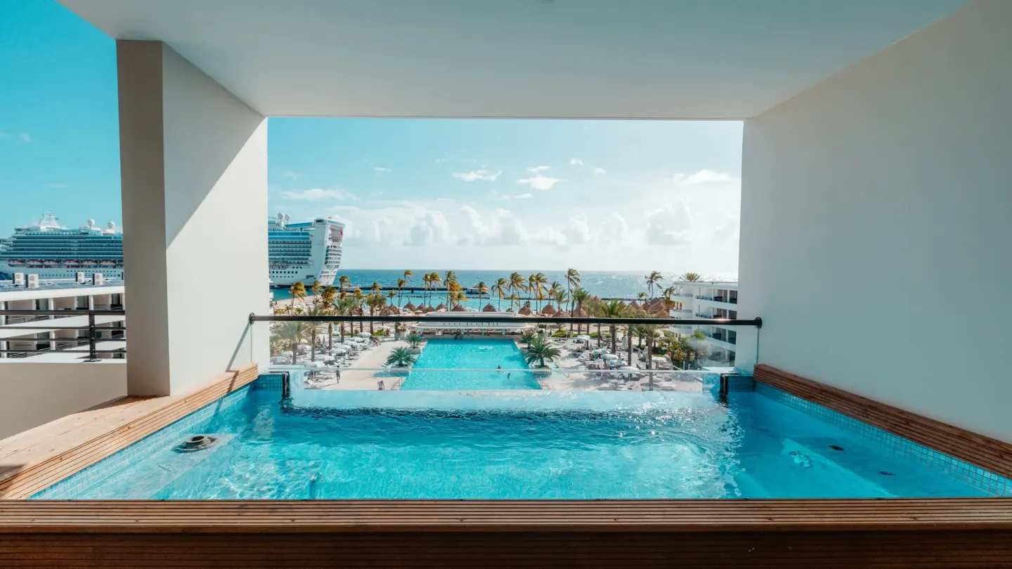Balcony plunge pool overlooking the resort pools and sea at Mangrove Beach Corendon Curacao Resort.