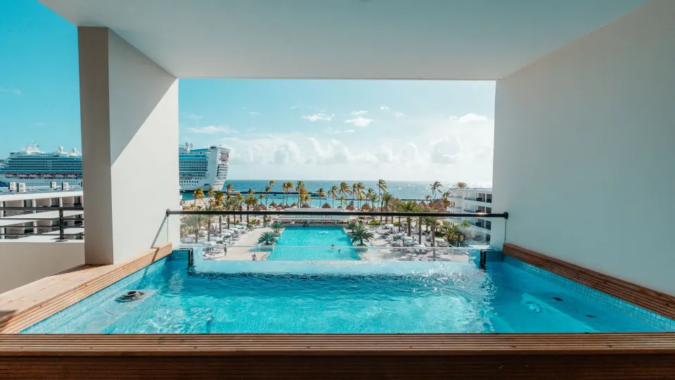Balcony plunge pool overlooking the resort pools and sea at Mangrove Beach Corendon Curacao Resort.