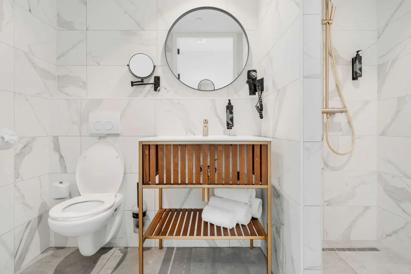 Bathroom with vanity, toilet and walk-in shower at Mangrove Beach Corendon Curacao Resort.