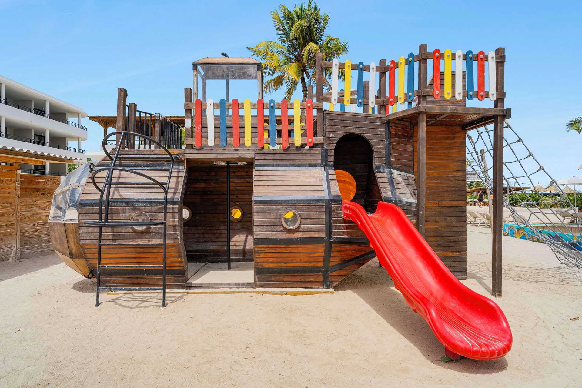 Pirate ship playground with a red slide at Mangrove Beach Corendon Curacao Resort.