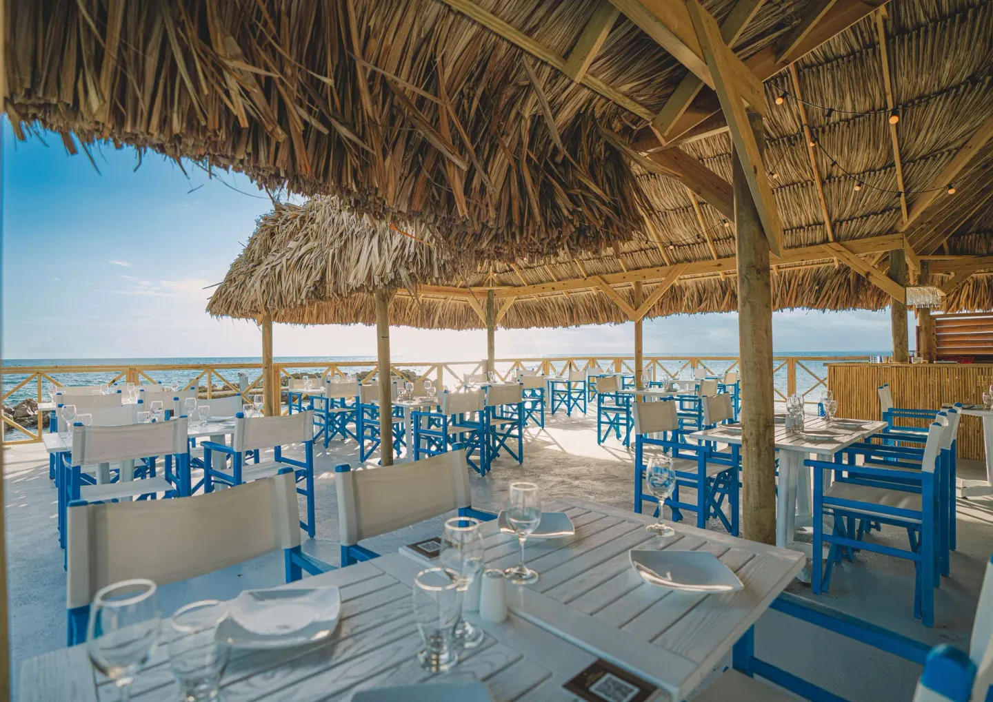 Oceanfront seafood restaurant seating at Mangrove Beach Corendon Curacao Resort.