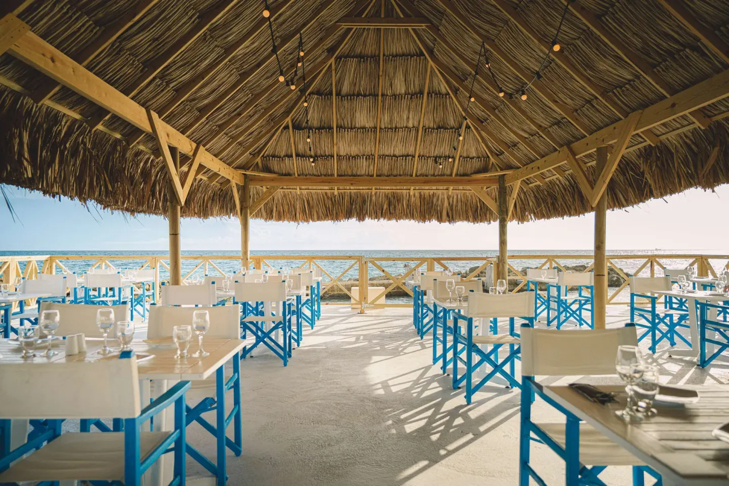 Thatched waterfront dining room at Mangrove Beach Corendon Curacao Resort.