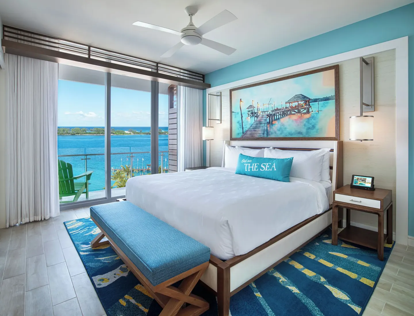King guest room with balcony and water view at Margaritaville Beach Resort - Nassau.