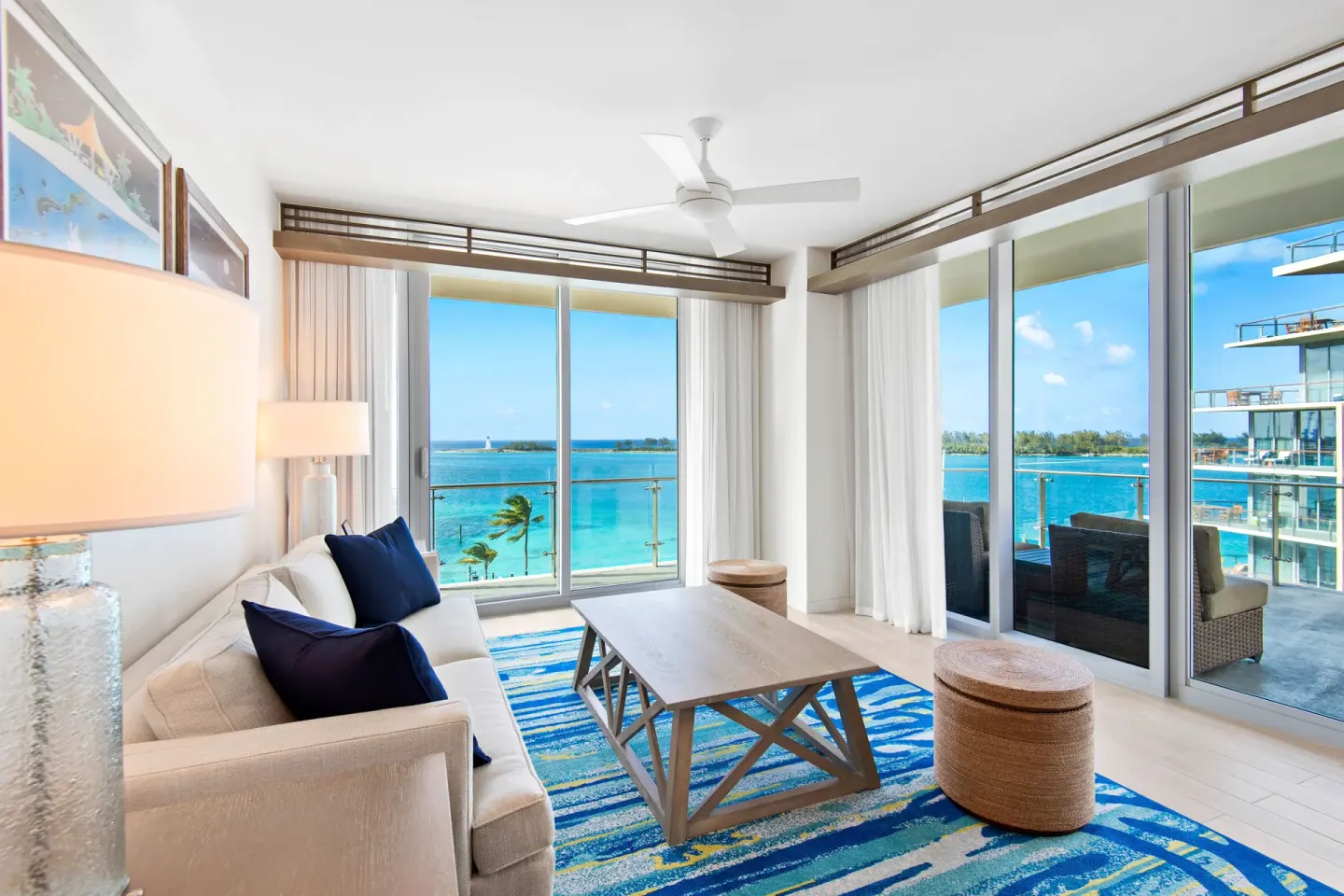 Living room with balcony and water views at Margaritaville Beach Resort - Nassau.