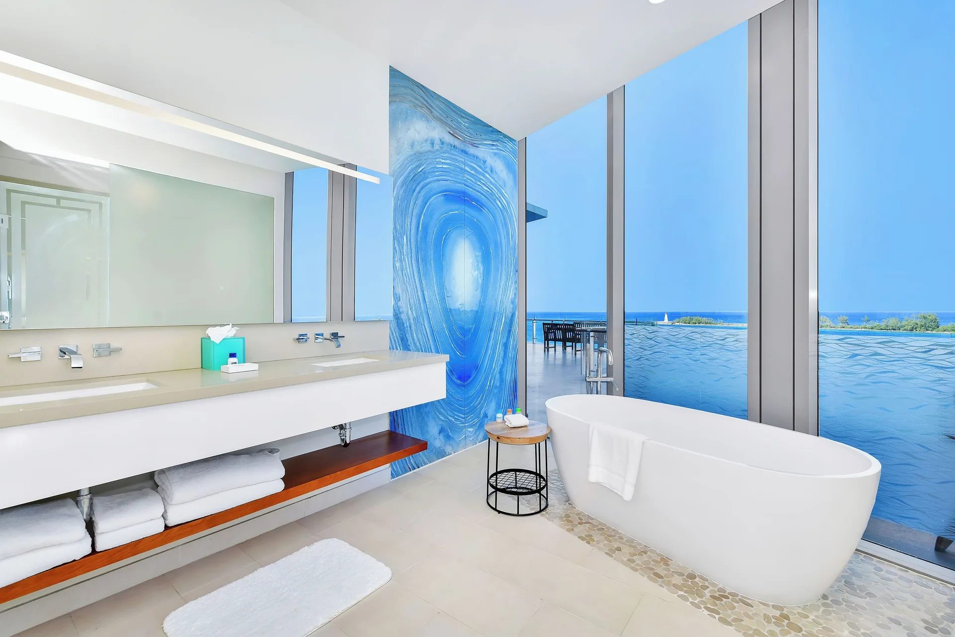 Ocean-view bathroom with freestanding tub at Margaritaville Beach Resort - Nassau.