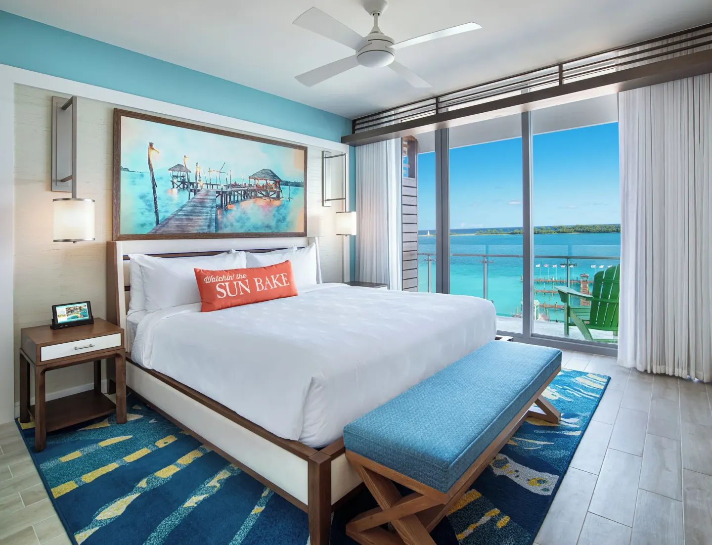 King bed guest room with balcony and ocean view at Margaritaville Beach Resort - Nassau.