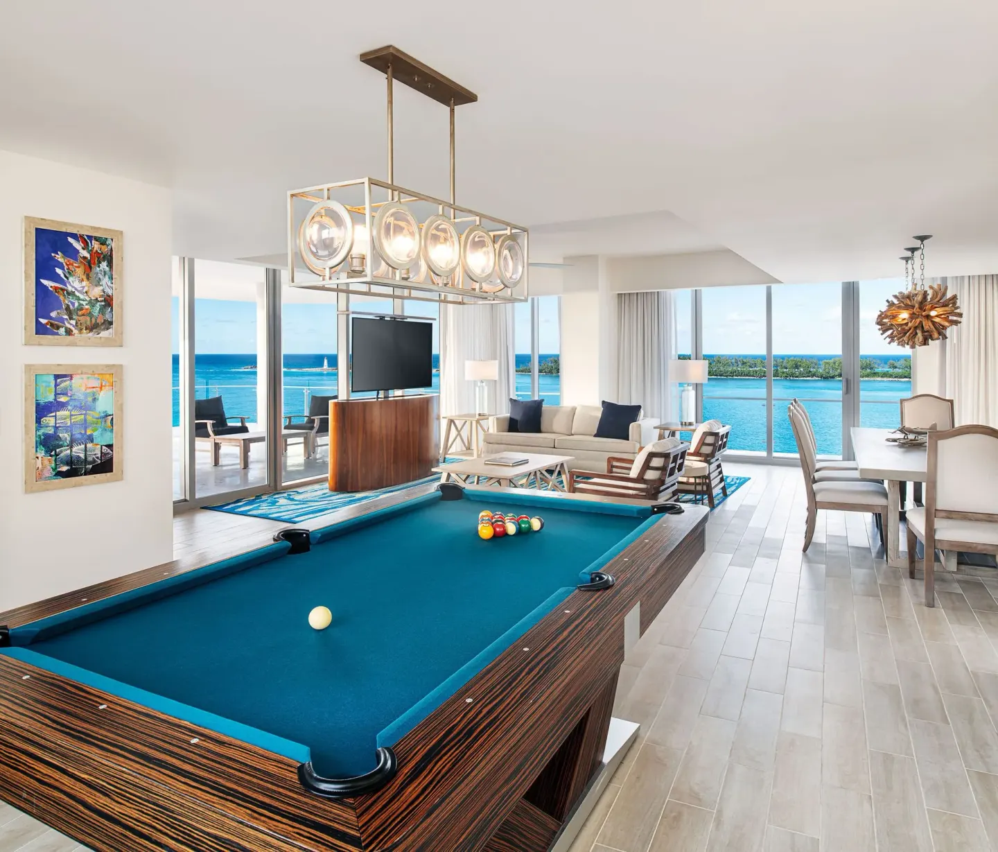Oceanview suite living area with a pool table at Margaritaville Beach Resort - Nassau.