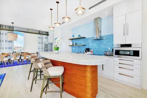 Open suite kitchen and dining area at Margaritaville Beach Resort - Nassau.