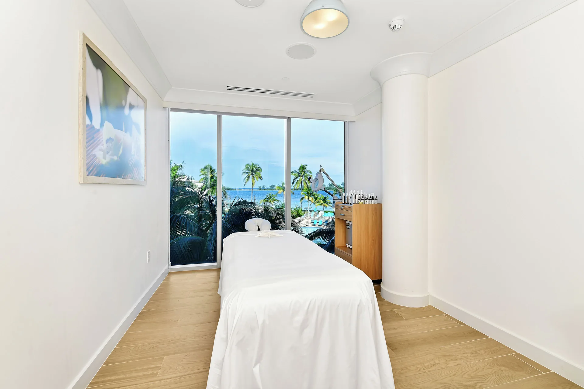 Spa treatment room with a massage table at Margaritaville Beach Resort - Nassau.