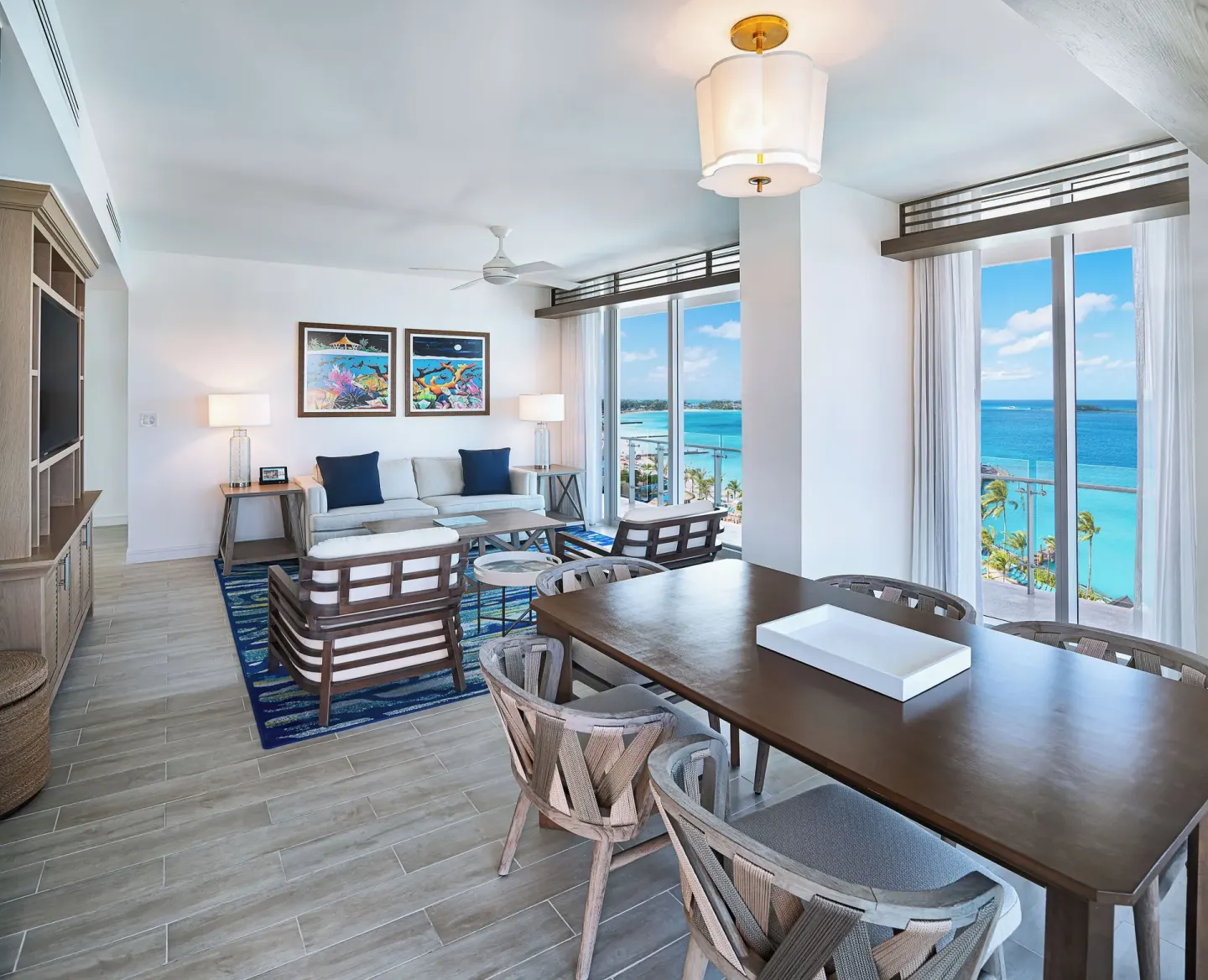 Suite dining and living area with ocean windows at Margaritaville Beach Resort - Nassau.