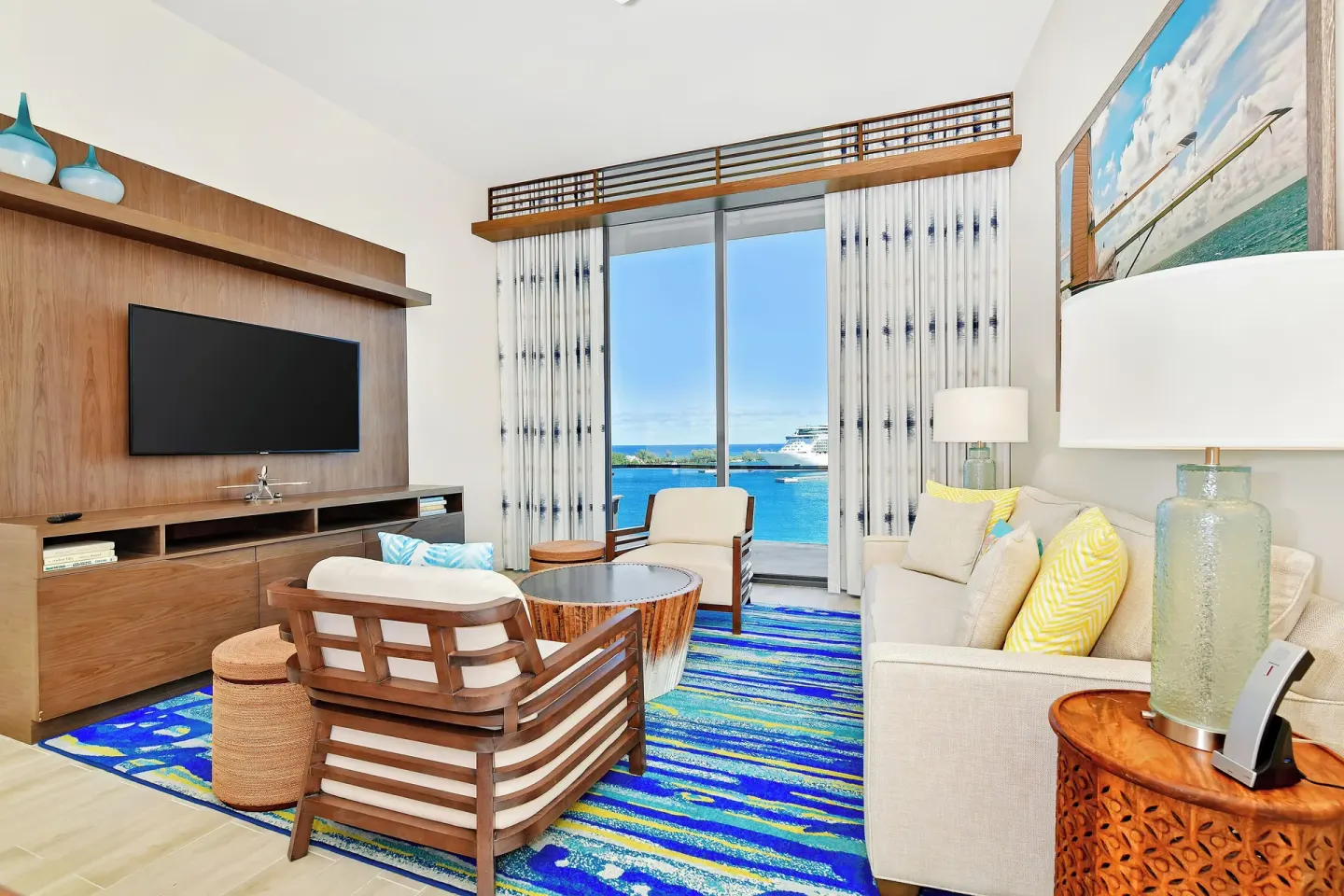 Living area with balcony water view at Margaritaville Beach Resort - Nassau.