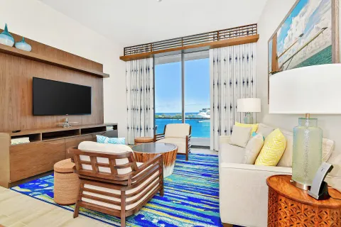 Living area with balcony water view at Margaritaville Beach Resort - Nassau.