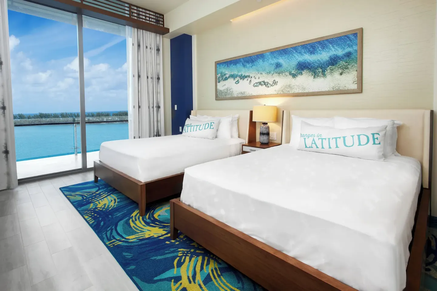 Two-bed guest room with balcony water view at Margaritaville Beach Resort - Nassau.