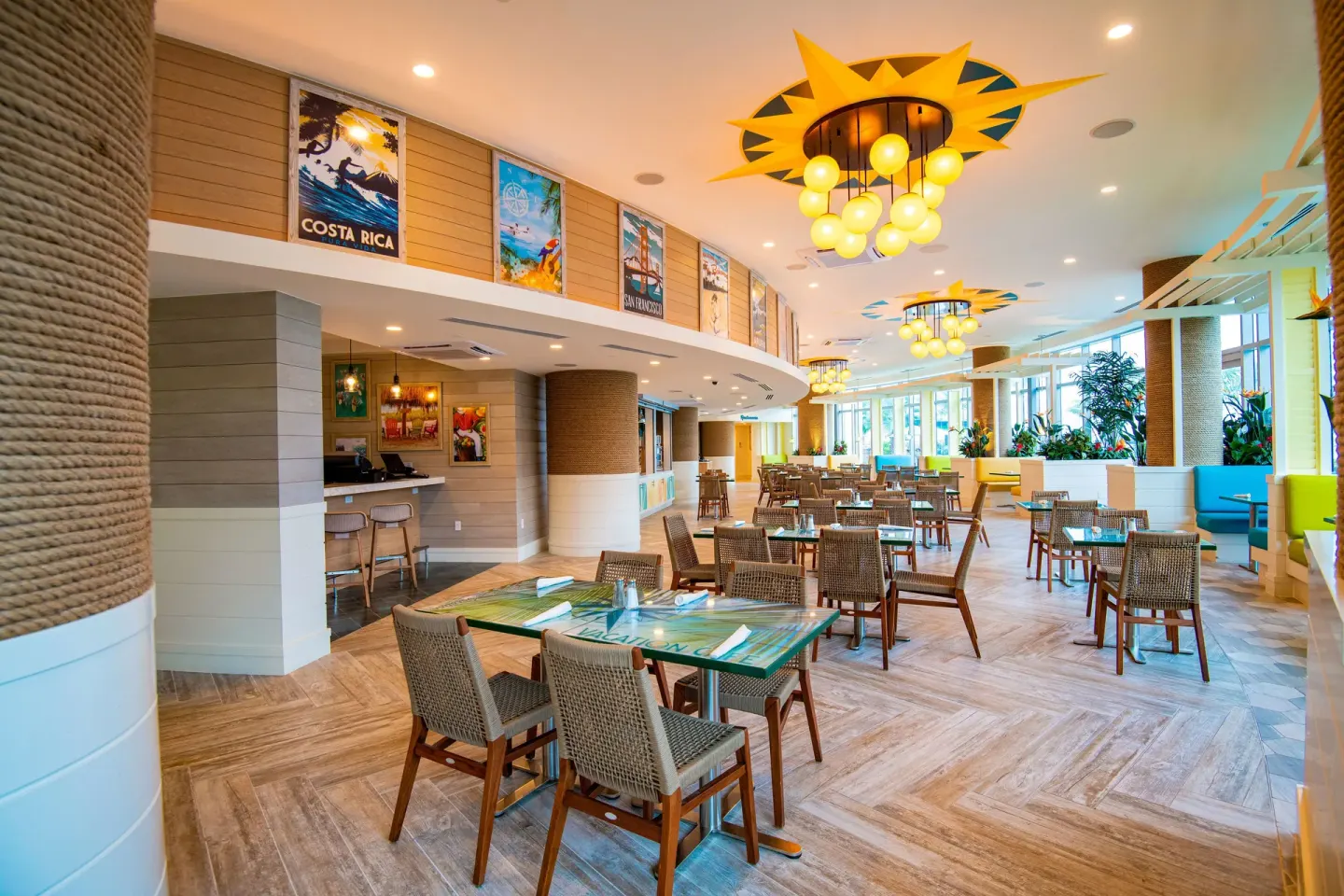 Bright resort dining room with wicker chairs at Margaritaville Beach Resort - Nassau.