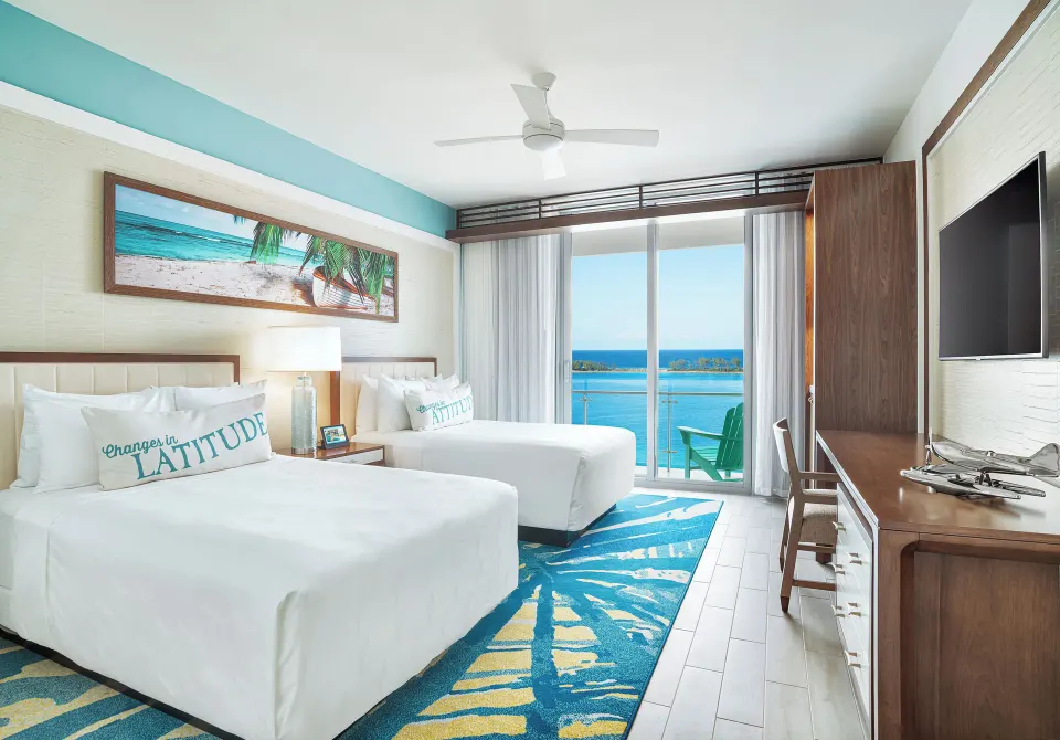 Two-bed deluxe oceanfront room with balcony at Margaritaville Beach Resort - Nassau.