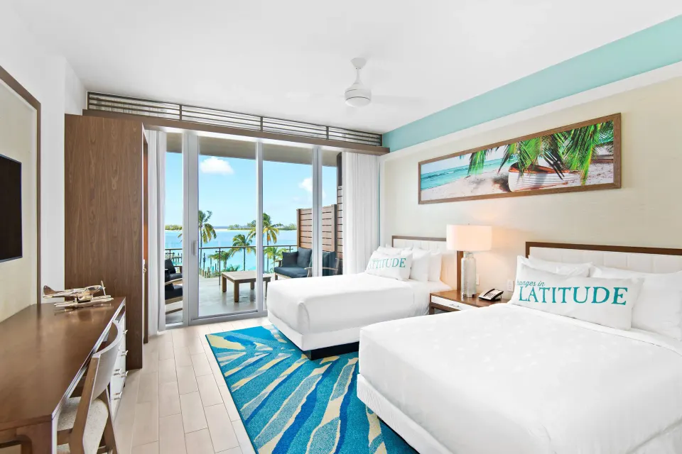 Deluxe oceanfront room with two beds and balcony at Margaritaville Beach Resort - Nassau.